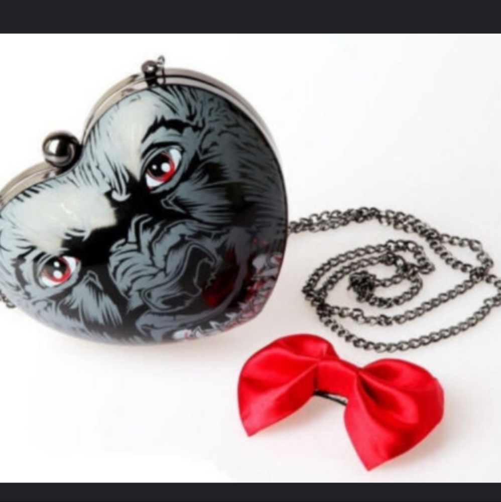 Iron Fist Heart-Shaped Crossbody Bag with Red and Black Design